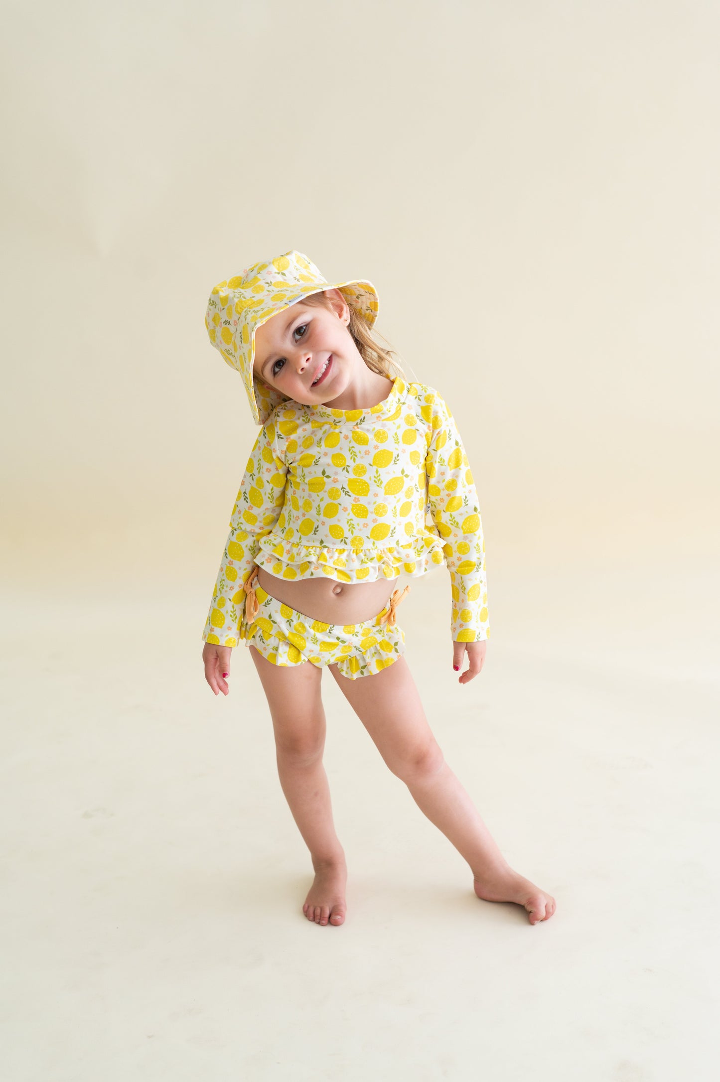 LEMON BLOSSOMS DREAM RASH GUARD RUFFLE TWO-PIECE SWIM SUIT