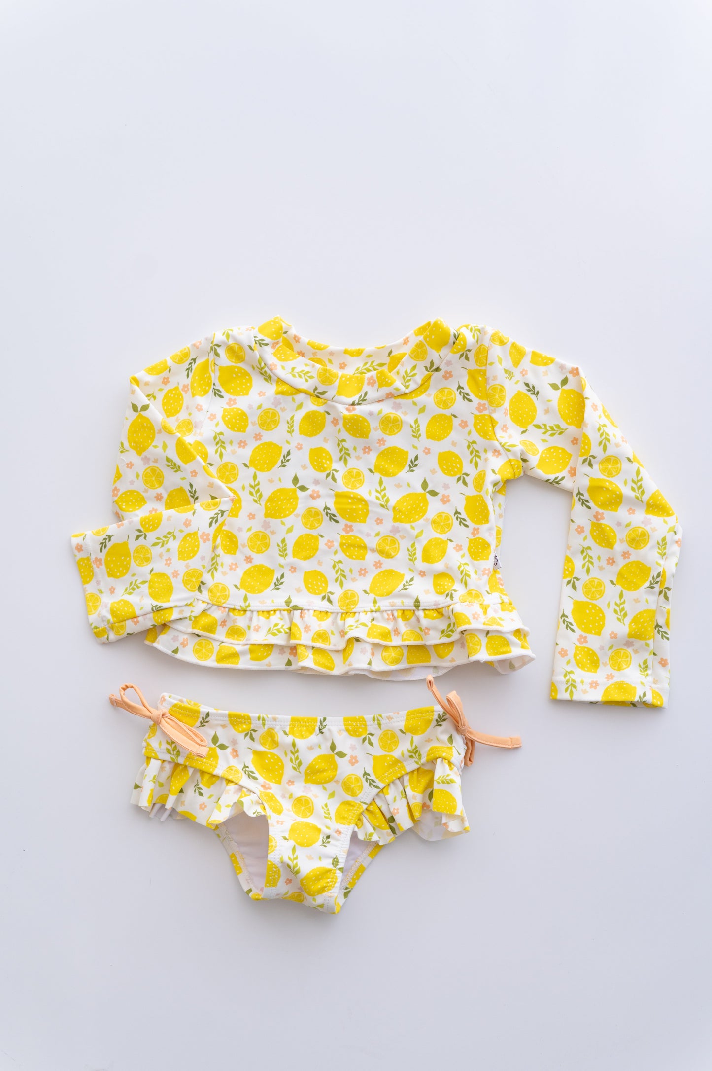 LEMON BLOSSOMS DREAM RASH GUARD RUFFLE TWO-PIECE SWIM SUIT