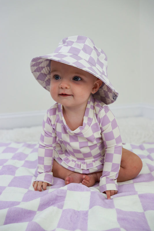 PERIWINKLE CHECKERS DREAM RASH GUARD RUFFLE TWO-PIECE SWIM SUIT