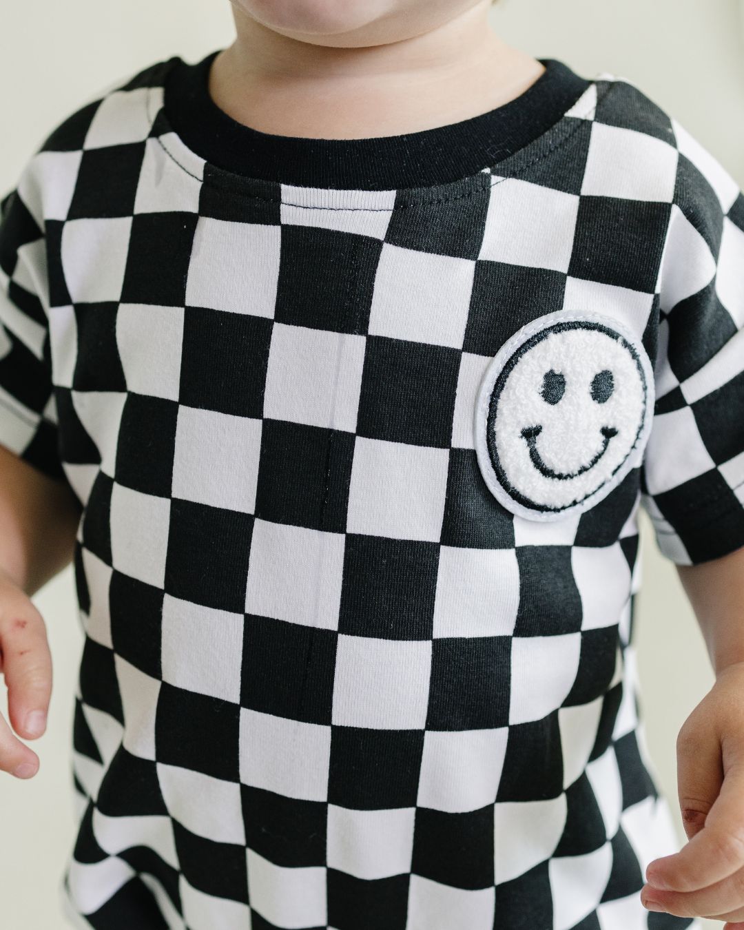 Short Sleeve Bubble Romper | Checkered Smiley Black - Mack & Harvie