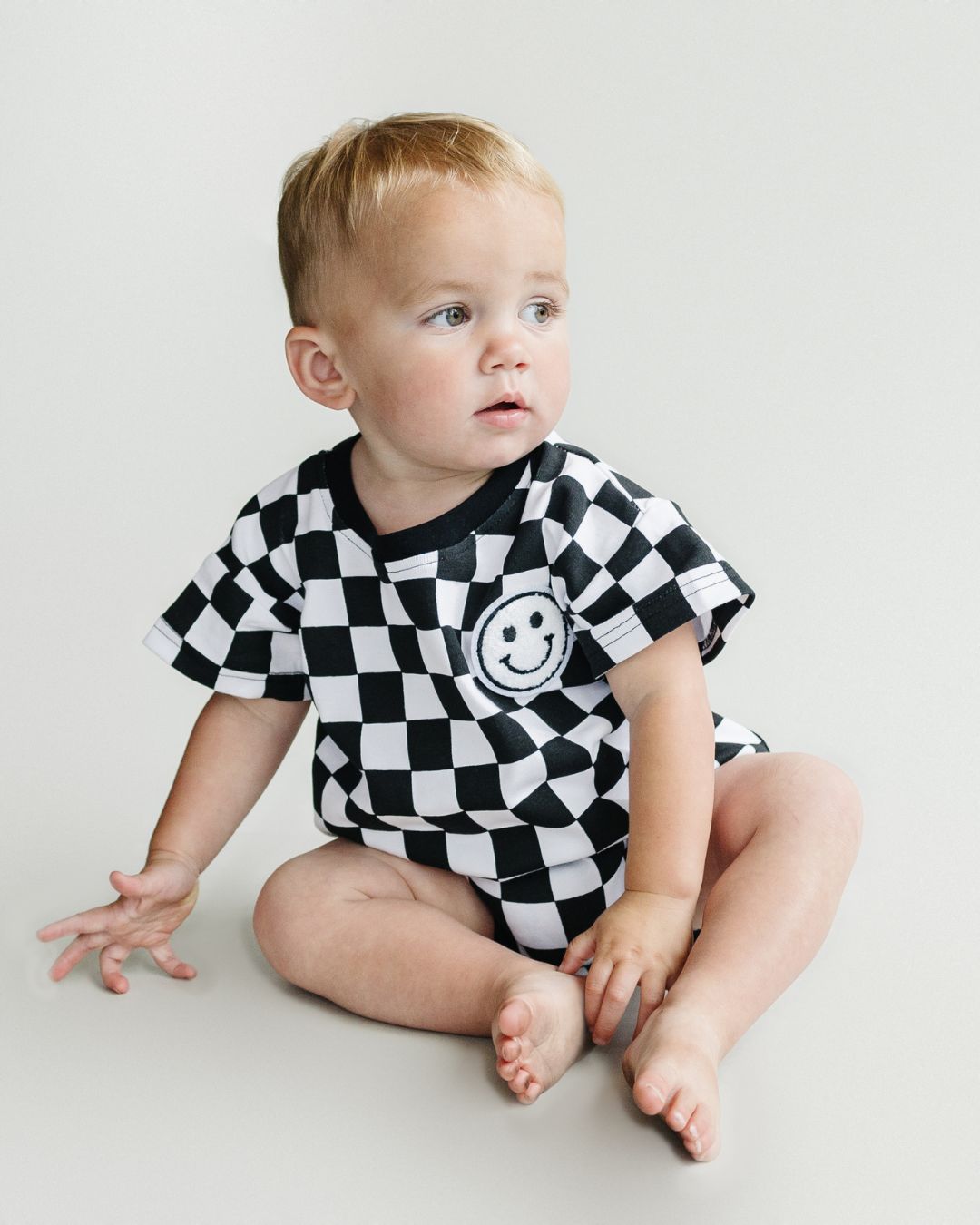 Short Sleeve Bubble Romper | Checkered Smiley Black - Mack & Harvie
